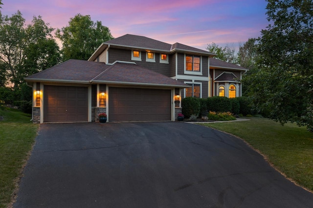 12346 Harvard Ave, Eden Prairie, MN 55347 - view of front facade featuring driveway, a front lawn, an attached garage, and stone siding