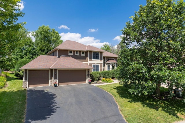 12346 Harvard Ave, Eden Prairie, MN 55347 - view of front of property featuring a front lawn, a garage, and asphalt driveway