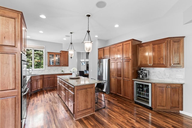 12346 Harvard Ave, Eden Prairie, MN 55347 - kitchen featuring beverage cooler, appliances with stainless steel finishes, brown cabinetry, dark wood-style floors, and recessed lighting