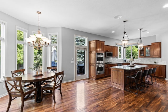 12346 Harvard Ave, Eden Prairie, MN 55347 - kitchen featuring appliances with stainless steel finishes, plenty of natural light, a kitchen island, decorative backsplash, and recessed lighting