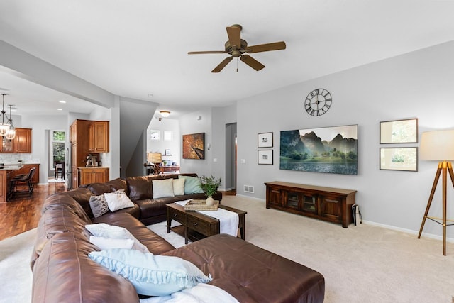 12346 Harvard Ave, Eden Prairie, MN 55347 - carpeted living room featuring a ceiling fan, recessed lighting, and a chandelier
