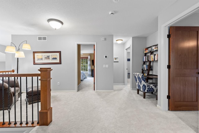 12346 Harvard Ave, Eden Prairie, MN 55347 - corridor featuring carpet floors and a textured ceiling
