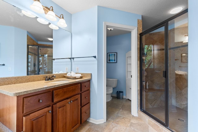 12346 Harvard Ave, Eden Prairie, MN 55347 - bathroom featuring vanity, a stall shower, and stone tile flooring