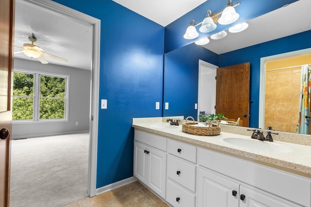 12346 Harvard Ave, Eden Prairie, MN 55347 - bathroom featuring double vanity, a ceiling fan, a shower with shower curtain, and tile patterned floors