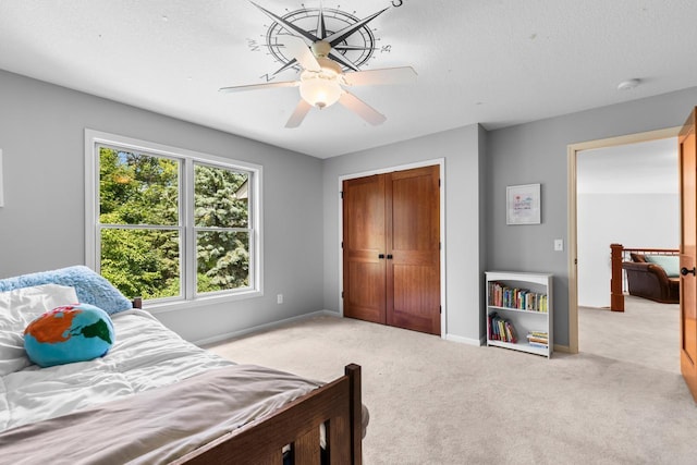 12346 Harvard Ave, Eden Prairie, MN 55347 - bedroom with light colored carpet, a ceiling fan, and a closet