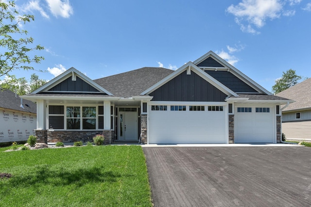 7617 Ocean Ave NE, Otsego, MN 55330 - craftsman house with board and batten siding, driveway, a front lawn, and stone siding