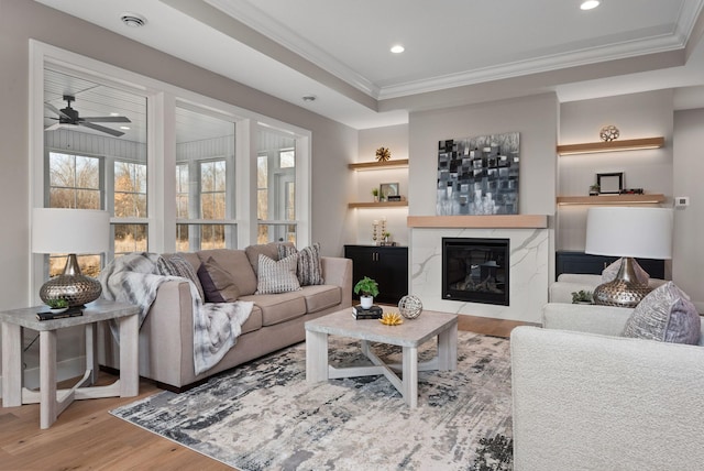 7617 Ocean Ave NE, Otsego, MN 55330 - living area with wood finished floors, ceiling fan, a fireplace, ornamental molding, and recessed lighting