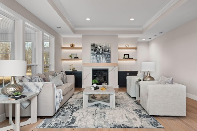 7617 Ocean Ave NE, Otsego, MN 55330 - living room with ornamental molding, wood finished floors, a tray ceiling, a fireplace, and recessed lighting