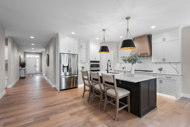 7617 Ocean Ave NE, Otsego, MN 55330 - kitchen with stainless steel appliances, wall chimney range hood, backsplash, white cabinetry, and recessed lighting