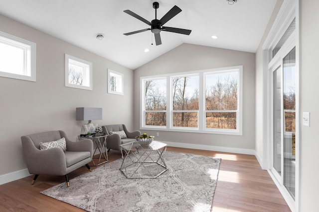 7617 Ocean Ave NE, Otsego, MN 55330 - living area featuring light wood finished floors, vaulted ceiling, a ceiling fan, and recessed lighting