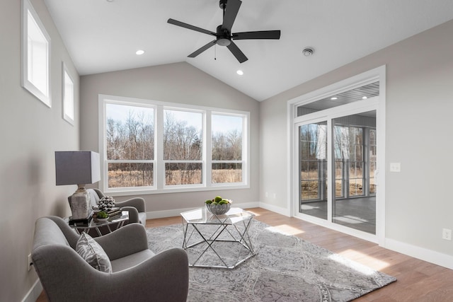 7617 Ocean Ave NE, Otsego, MN 55330 - living room with plenty of natural light, a ceiling fan, light wood-style flooring, recessed lighting, and vaulted ceiling