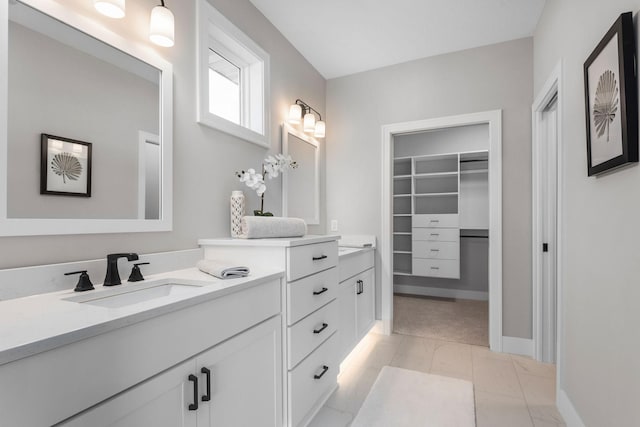 7617 Ocean Ave NE, Otsego, MN 55330 - bathroom featuring vanity and a walk in closet