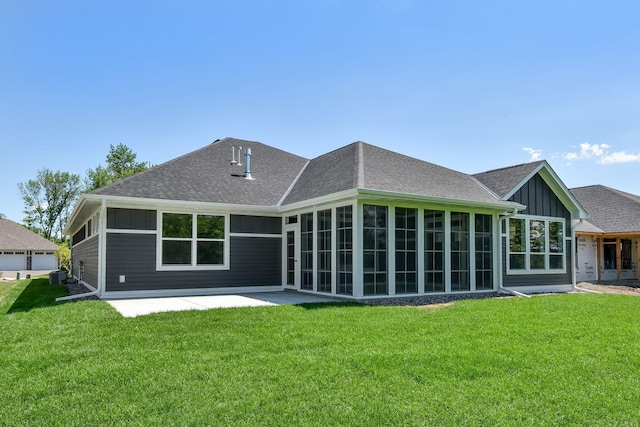 7617 Ocean Ave NE, Otsego, MN 55330 - back of property with board and batten siding, a yard, a patio area, a sunroom, and a shingled roof