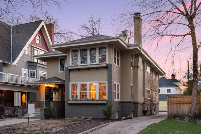 1770 Humboldt Ave S Unit 1, Minneapolis, MN 55403 - view of front facade featuring a chimney and stucco siding