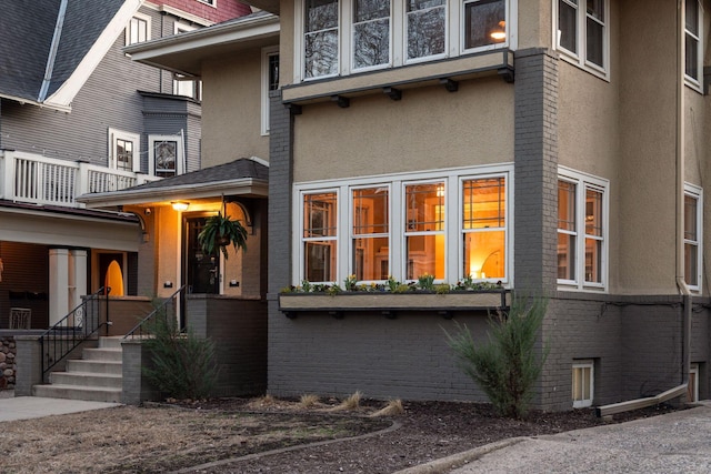 1770 Humboldt Ave S Unit 1, Minneapolis, MN 55403 - view of home's exterior with stucco siding, brick siding, and a balcony