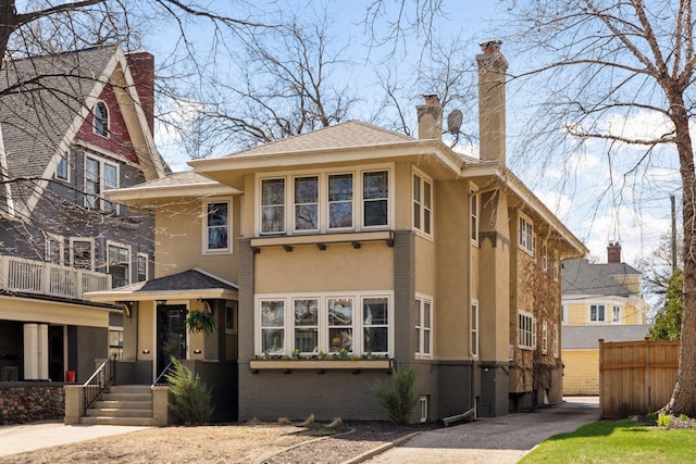 1770 Humboldt Ave S Unit 1, Minneapolis, MN 55403 - view of front of property with stucco siding, a chimney, and brick siding