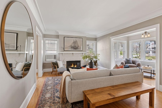 1770 Humboldt Ave S Unit 1, Minneapolis, MN 55403 - living area with a brick fireplace, light wood-type flooring, crown molding, and a chandelier