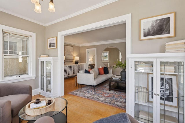 1770 Humboldt Ave S Unit 1, Minneapolis, MN 55403 - living area with crown molding, french doors, wood finished floors, a chandelier, and arched walkways