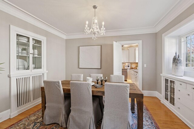 1770 Humboldt Ave S Unit 1, Minneapolis, MN 55403 - dining area with a chandelier, light wood-style flooring, and ornamental molding
