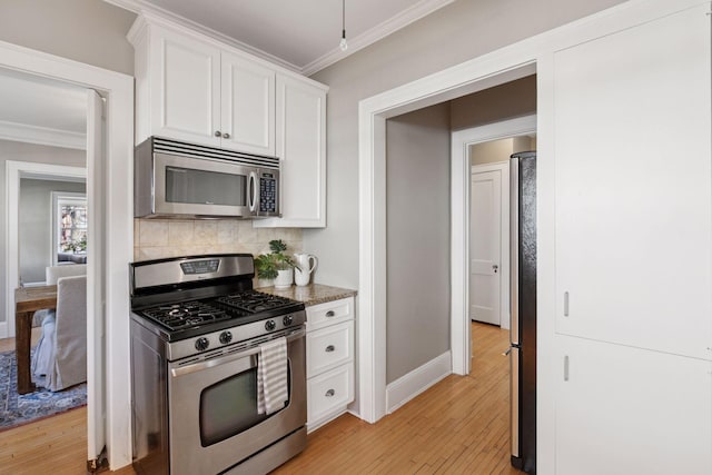 1770 Humboldt Ave S Unit 1, Minneapolis, MN 55403 - kitchen with appliances with stainless steel finishes, crown molding, light wood-style flooring, white cabinets, and tasteful backsplash