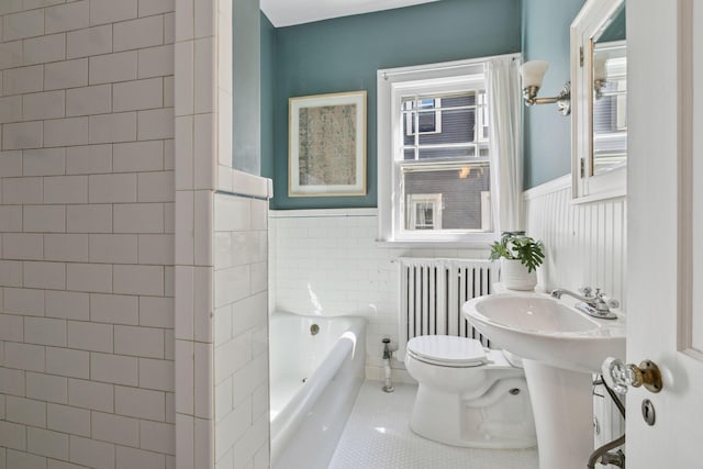 1770 Humboldt Ave S Unit 1, Minneapolis, MN 55403 - full bathroom featuring radiator heating unit, a wainscoted wall, tile patterned floors, a bath, and healthy amount of natural light