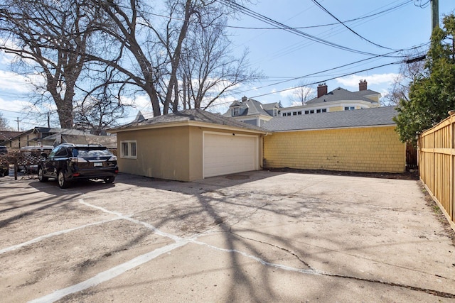 1770 Humboldt Ave S Unit 1, Minneapolis, MN 55403 - view of home's exterior with an outbuilding, stucco siding, and driveway