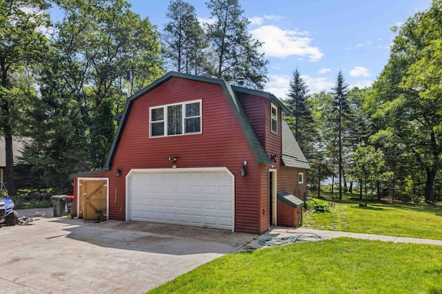 4745 Patterson Trl, Brainerd, MN 56401 - view of home's exterior featuring a gambrel roof, driveway, a yard, and a garage
