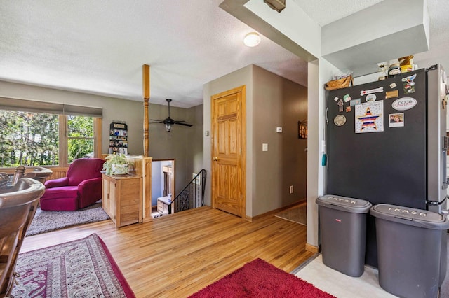 4745 Patterson Trl, Brainerd, MN 56401 - interior space with light wood-style flooring, a textured ceiling, and a ceiling fan