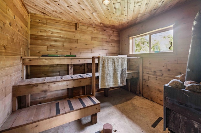 4745 Patterson Trl, Brainerd, MN 56401 - bedroom with wood walls, a sauna, wood ceiling, and concrete floors