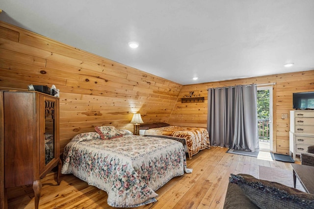 4745 Patterson Trl, Brainerd, MN 56401 - bedroom with access to outside, light wood-type flooring, recessed lighting, and wooden walls