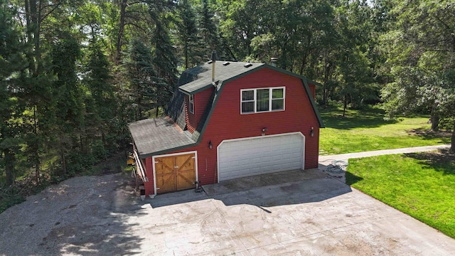 4745 Patterson Trl, Brainerd, MN 56401 - garage with driveway and a forest view