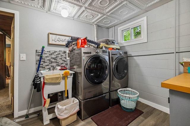 4745 Patterson Trl, Brainerd, MN 56401 - laundry room featuring washing machine and clothes dryer and wood finished floors