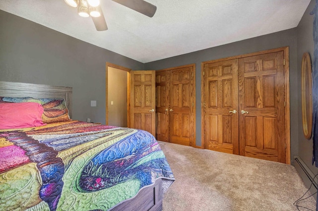 4745 Patterson Trl, Brainerd, MN 56401 - carpeted bedroom with two closets, ceiling fan, and a baseboard radiator