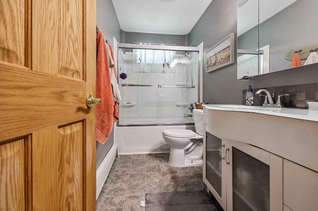4745 Patterson Trl, Brainerd, MN 56401 - bathroom featuring baseboard heating, vanity, enclosed tub / shower combo, and stone finish flooring