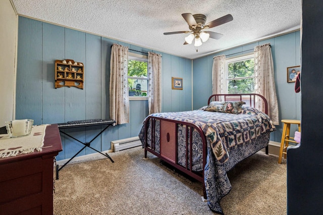 4745 Patterson Trl, Brainerd, MN 56401 - bedroom with a baseboard radiator, multiple windows, carpet flooring, a textured ceiling, and a ceiling fan