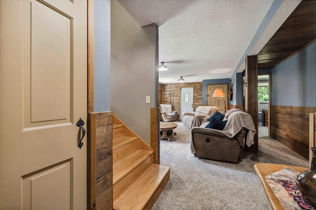 4745 Patterson Trl, Brainerd, MN 56401 - carpeted living area featuring a textured ceiling and stairway