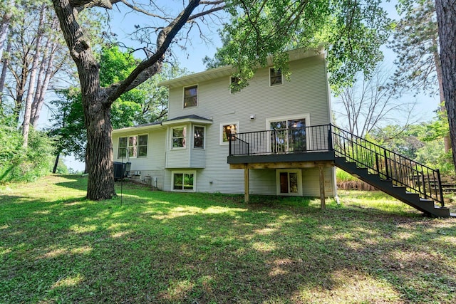 621 Twelve Oaks Ln, Hudson, WI 54016 - back of property featuring stairway, a wooden deck, and a lawn