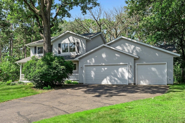 621 Twelve Oaks Ln, Hudson, WI 54016 - view of front facade with a garage, a front lawn, and driveway