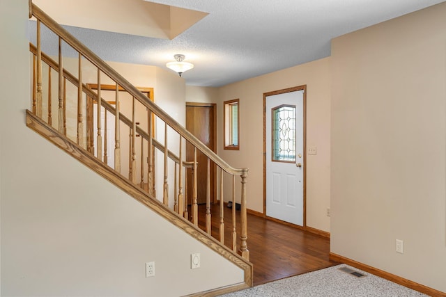 621 Twelve Oaks Ln, Hudson, WI 54016 - foyer entrance featuring stairs and a textured ceiling