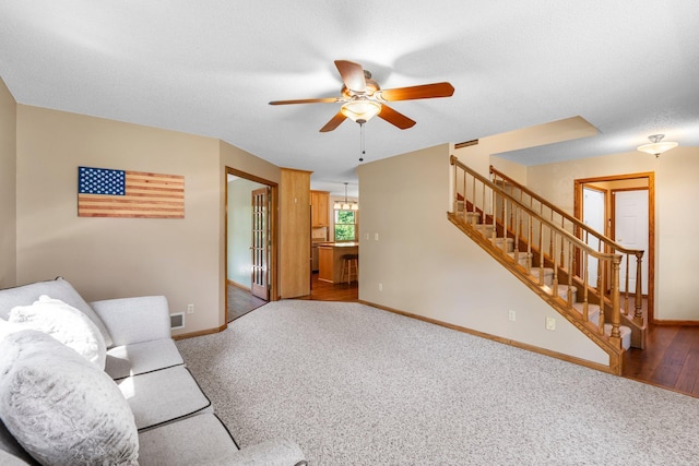 621 Twelve Oaks Ln, Hudson, WI 54016 - unfurnished living room with ceiling fan, stairs, and carpet