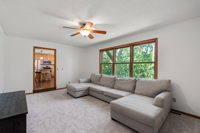 621 Twelve Oaks Ln, Hudson, WI 54016 - carpeted living room with ceiling fan and a textured ceiling