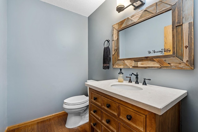 621 Twelve Oaks Ln, Hudson, WI 54016 - bathroom with wood finished floors, vanity, and a textured ceiling