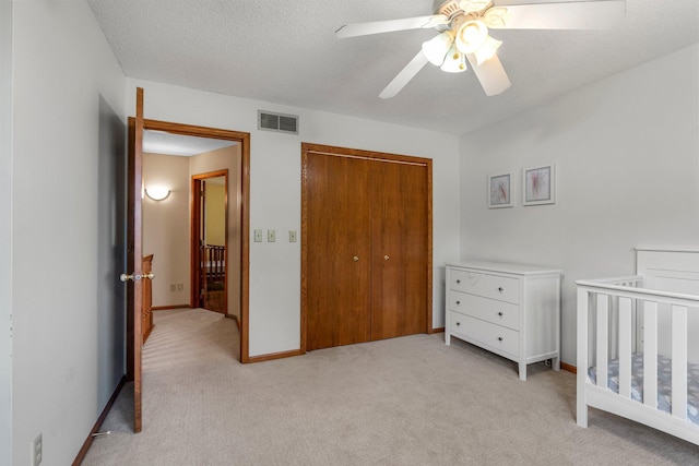621 Twelve Oaks Ln, Hudson, WI 54016 - bedroom featuring light carpet, a closet, and ceiling fan