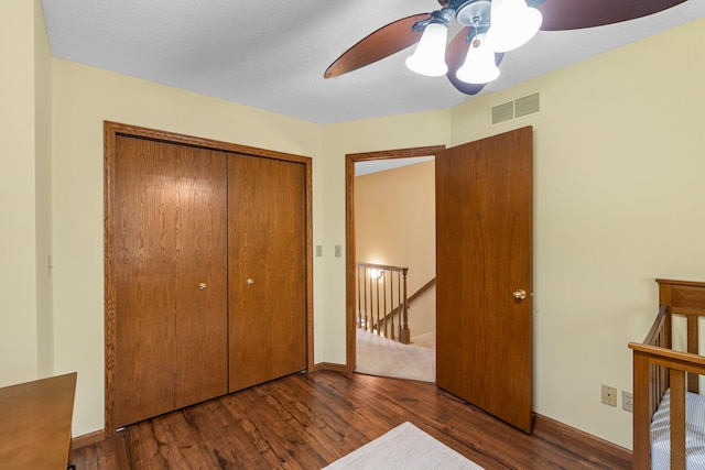 621 Twelve Oaks Ln, Hudson, WI 54016 - unfurnished bedroom featuring wood finished floors, a closet, and a ceiling fan