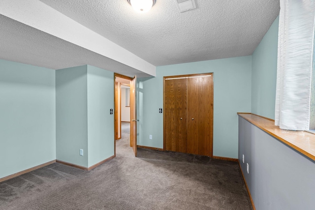 621 Twelve Oaks Ln, Hudson, WI 54016 - unfurnished bedroom with a textured ceiling, carpet, and a closet