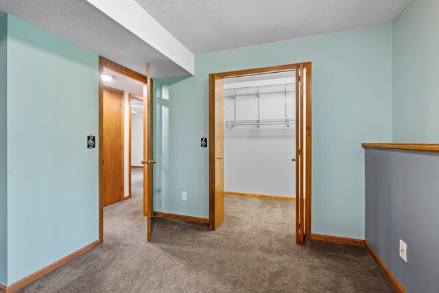 621 Twelve Oaks Ln, Hudson, WI 54016 - unfurnished bedroom with carpet and a textured ceiling