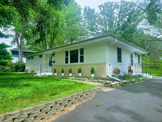 11509 Palmer Rd, Bloomington, MN 55437 - single story home featuring brick siding and a front lawn