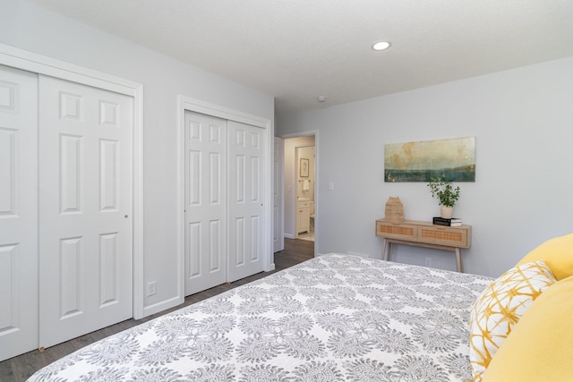 11509 Palmer Rd, Bloomington, MN 55437 - bedroom featuring two closets, dark wood finished floors, and recessed lighting