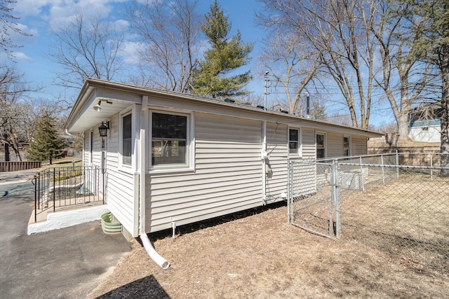 11509 Palmer Rd, Bloomington, MN 55437 - view of home's exterior featuring a gate