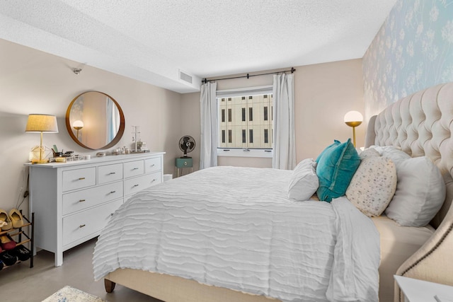 121 Washington Ave S Unit 513, Minneapolis, MN 55401 - bedroom featuring a textured ceiling and wallpapered walls